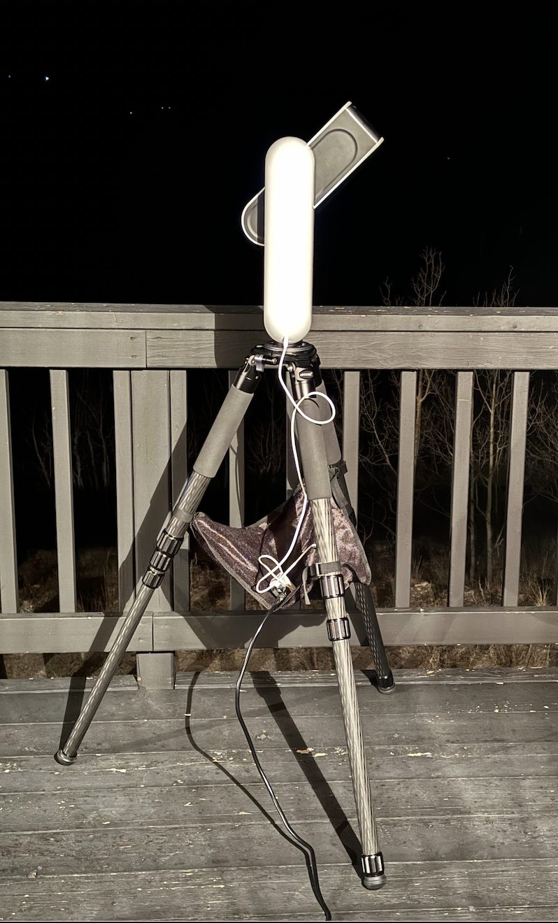 A Vespera smart telescope on a carbon-fiber tripod imaging under the night sky from the observation deck of the Buffalo Ridge Observatory, near Como, Colorado
